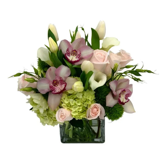 Elegant Pink Orchids and roses in a sophisticated floral arrangement.